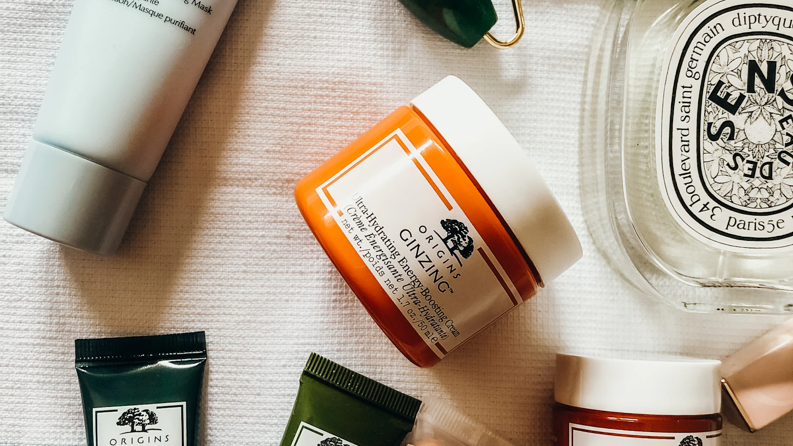 A person applying skincare as part of a morning beauty routine
