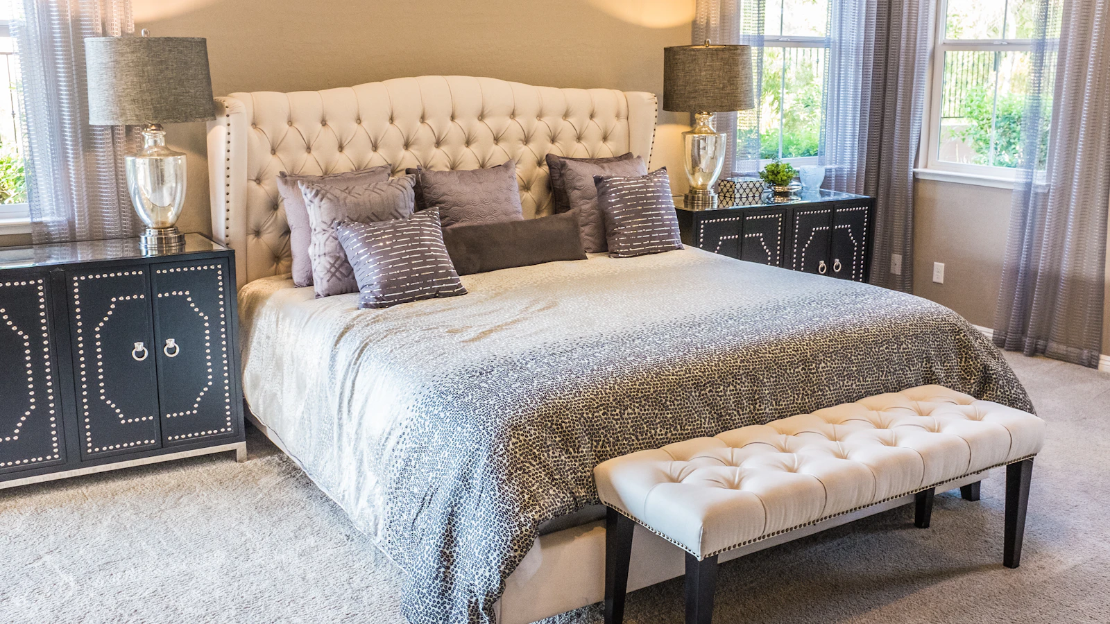 A quiet bedroom with soft linens and natural light
